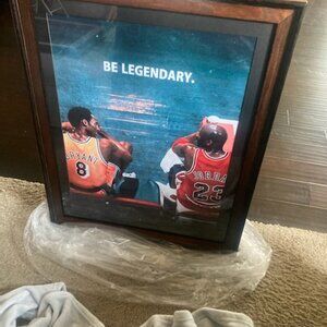 Micheal Jordan and Kolby Bryant talking on the bench Legends